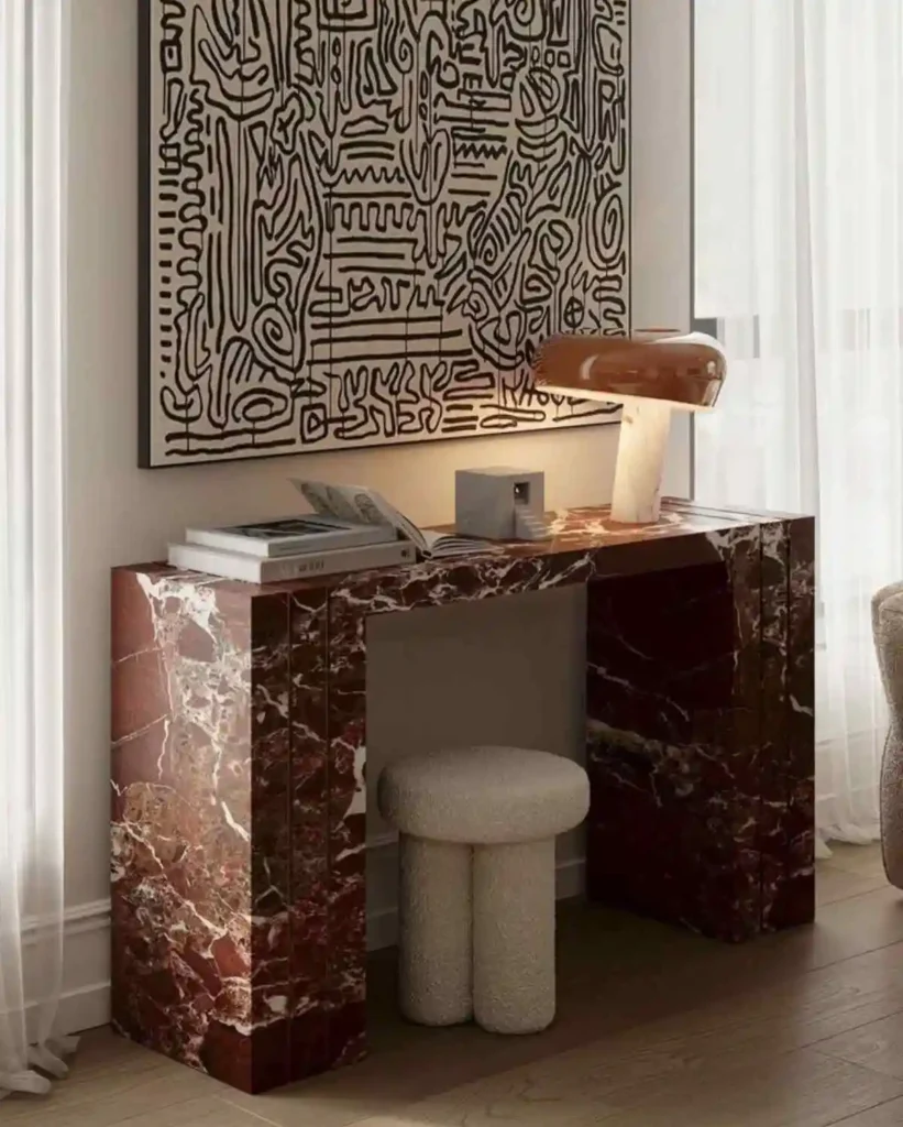 modern console table in entryway with art above