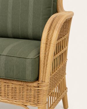 Close-up detail of the hand-woven rattan arm and side panel of the Palma lounge chair